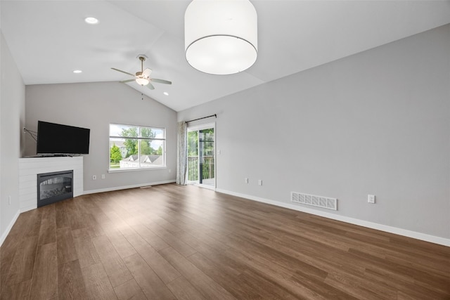 1333 Truman Ct NE Unit B, Cedar Rapids, IA 52402 - unfurnished living room featuring a ceiling fan, wood finished floors, baseboards, vaulted ceiling, and a glass covered fireplace