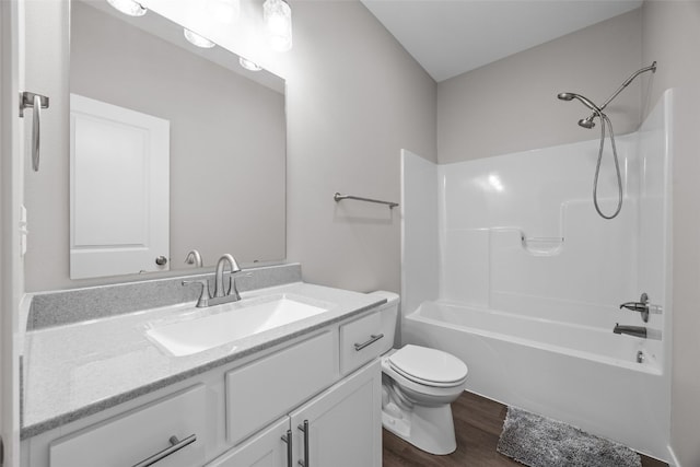1333 Truman Ct NE Unit B, Cedar Rapids, IA 52402 - full bath featuring toilet, vanity, wood finished floors, and washtub / shower combination