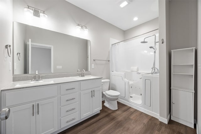1333 Truman Ct NE Unit B, Cedar Rapids, IA 52402 - full bathroom with toilet, double vanity, and wood finished floors