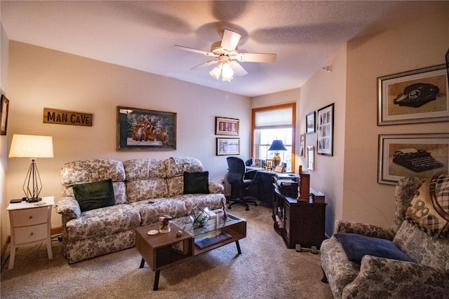 1701 130th St Unit 306, Anamosa, IA 52205 - living room with an office area, carpet, and a ceiling fan