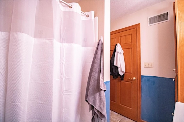 1701 130th St Unit 306, Anamosa, IA 52205 - bathroom featuring a shower with shower curtain