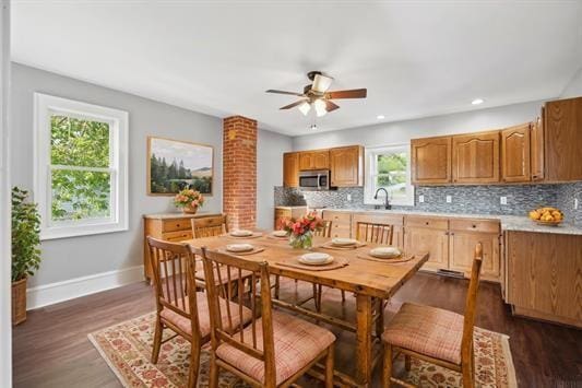 611 3rd Ave NE, Independence, IA 50644 - dining room with ceiling fan, baseboards, recessed lighting, and dark wood-type flooring