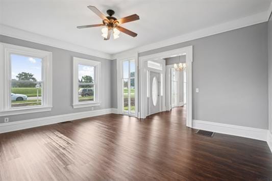 611 3rd Ave NE, Independence, IA 50644 - empty room featuring a chandelier, baseboards, wood finished floors, and ceiling fan