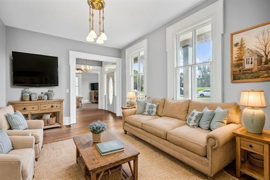 611 3rd Ave NE, Independence, IA 50644 - living area with a chandelier and wood finished floors