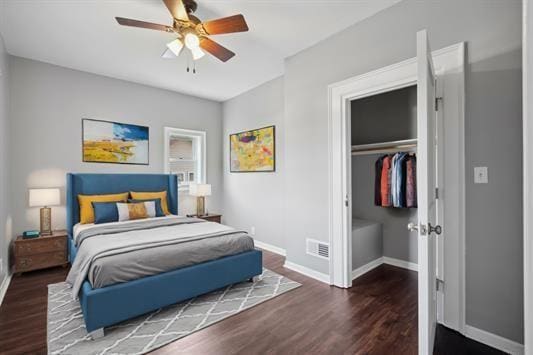 611 3rd Ave NE, Independence, IA 50644 - bedroom featuring baseboards, wood finished floors, a closet, and a ceiling fan