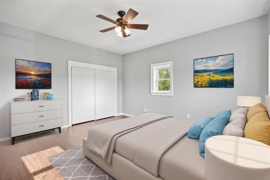 611 3rd Ave NE, Independence, IA 50644 - bedroom with wood finished floors, a closet, baseboards, and ceiling fan