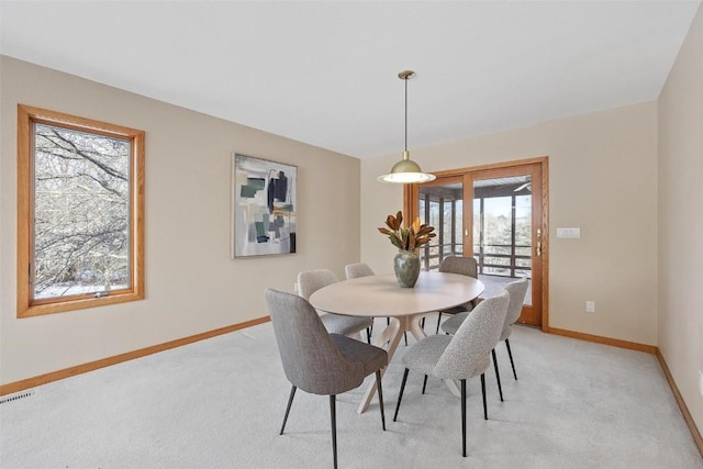 4644 Rapid Creek Trl NE, Iowa City, IA 52240 - dining area featuring light colored carpet