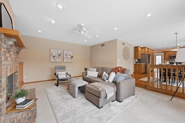 4644 Rapid Creek Trl NE, Iowa City, IA 52240 - living room with light carpet, recessed lighting, a fireplace, and ceiling fan