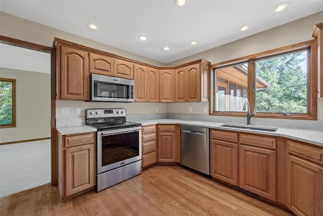4644 Rapid Creek Trl NE, Iowa City, IA 52240 - kitchen featuring appliances with stainless steel finishes, light wood-style floors, light countertops, and recessed lighting