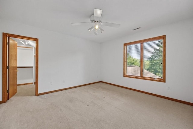 4644 Rapid Creek Trl NE, Iowa City, IA 52240 - spare room with light colored carpet and ceiling fan