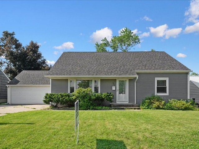 751 30th St NE, Cedar Rapids, IA 52402 - view of front of home with a front yard, driveway, a shingled roof, and an attached garage
