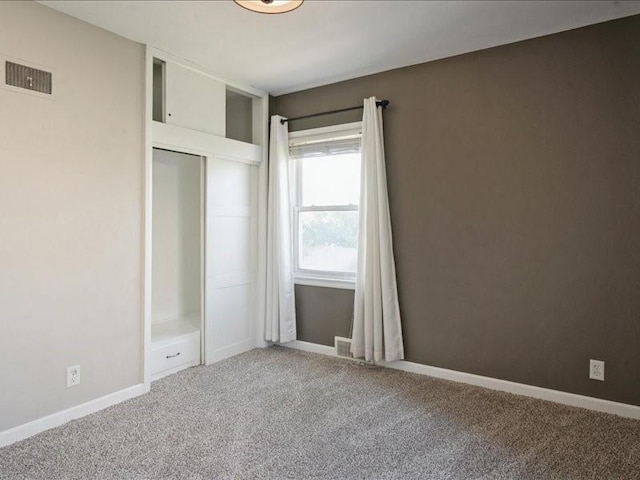 751 30th St NE, Cedar Rapids, IA 52402 - unfurnished bedroom featuring light colored carpet, a closet, and baseboards