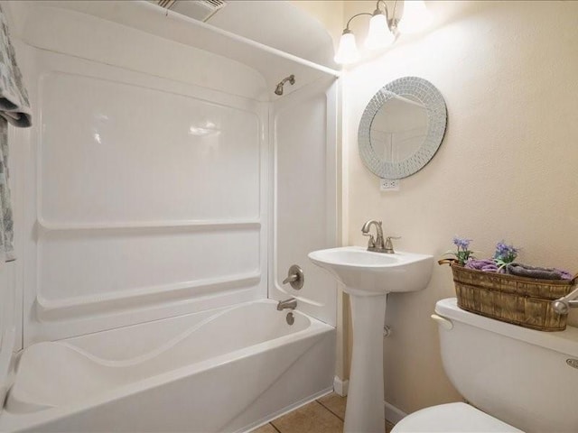 751 30th St NE, Cedar Rapids, IA 52402 - full bath featuring shower / tub combination, toilet, and tile patterned flooring