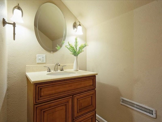 751 30th St NE, Cedar Rapids, IA 52402 - bathroom with vanity and vaulted ceiling