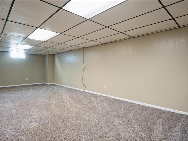 751 30th St NE, Cedar Rapids, IA 52402 - basement with carpet floors, baseboards, and a drop ceiling
