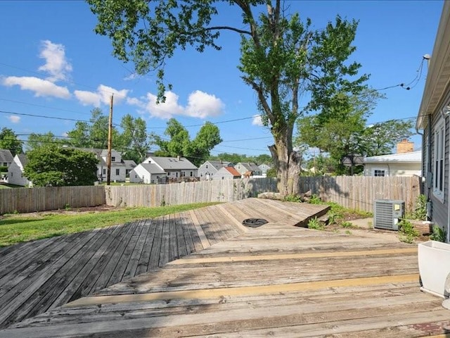 751 30th St NE, Cedar Rapids, IA 52402 - deck with cooling unit, a fenced backyard, and a residential view