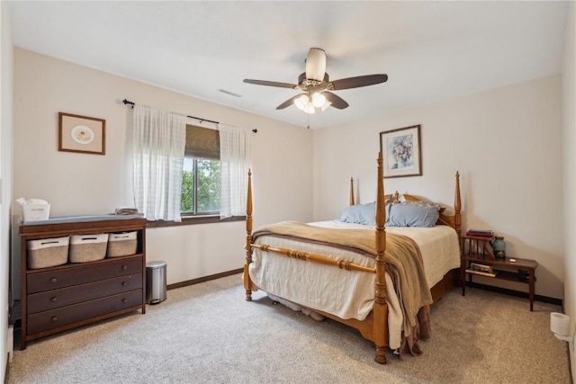 1015 Woodland Heights Ct SE Unit 14, Cedar Rapids, IA 52403 - bedroom with light colored carpet, baseboards, and ceiling fan