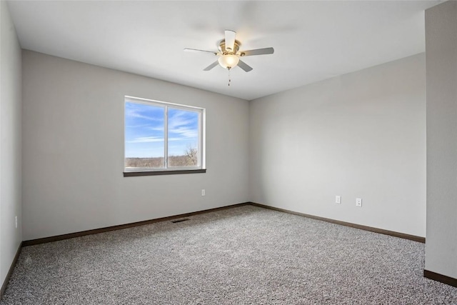 2004 Croell Ave, Tiffin, IA 52340 - carpeted empty room with a ceiling fan and baseboards