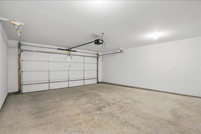 2004 Croell Ave, Tiffin, IA 52340 - garage featuring a garage door opener