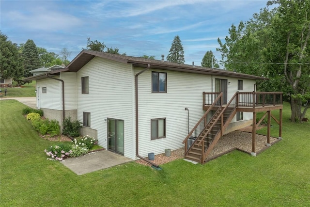 109 Oreole NE, Solon, IA 52333 - back of house featuring stairs, a yard, and a wooden deck