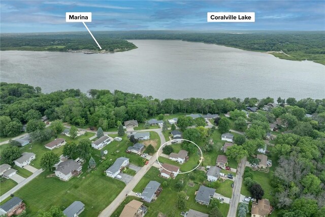 109 Oreole NE, Solon, IA 52333 - aerial overview of property's location featuring a nearby body of water, a forest, and nearby suburban area