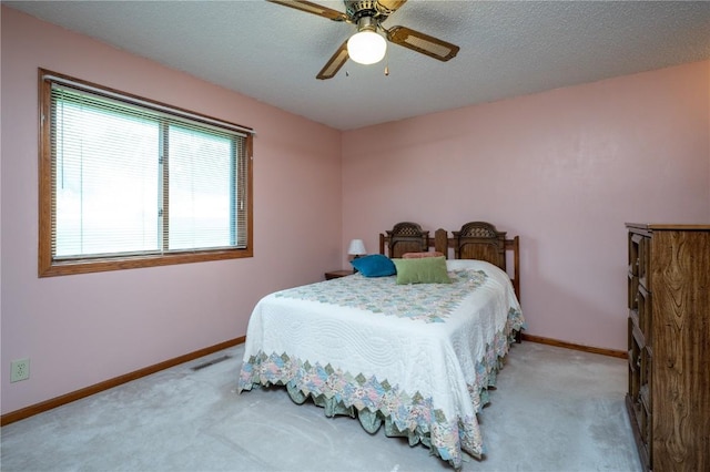 109 Oreole NE, Solon, IA 52333 - carpeted bedroom featuring baseboards, a ceiling fan, and a textured ceiling
