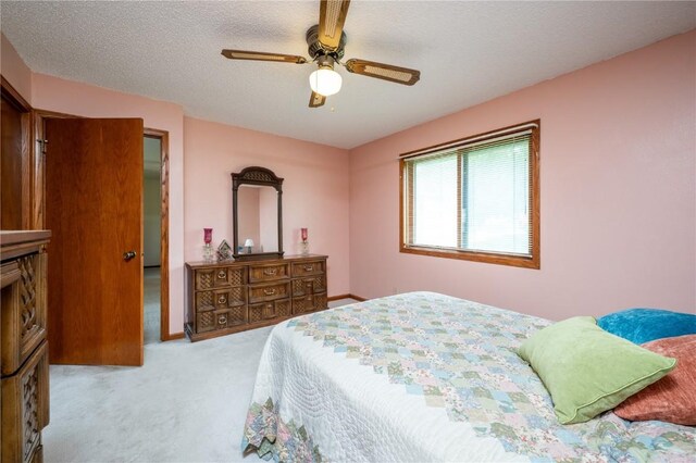 109 Oreole NE, Solon, IA 52333 - carpeted bedroom featuring ceiling fan and a textured ceiling