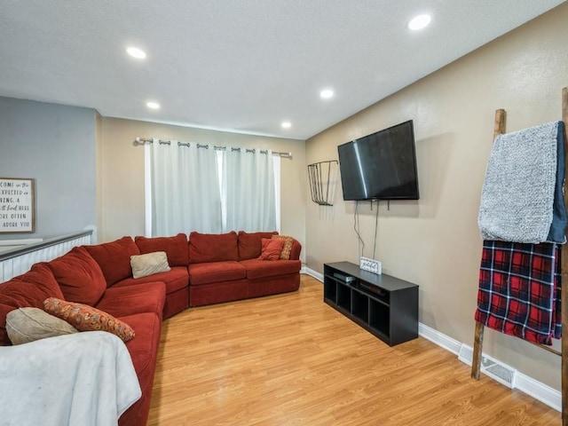 4721 Pine View Dr NE, Cedar Rapids, IA 52402 - living area with light wood finished floors, recessed lighting, and baseboards