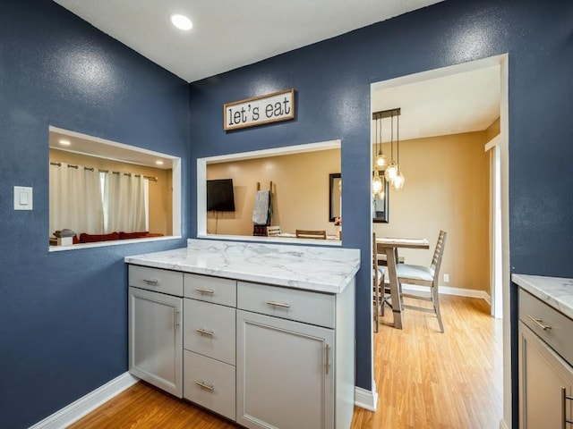 4721 Pine View Dr NE, Cedar Rapids, IA 52402 - bathroom featuring wood finished floors, vanity, baseboards, recessed lighting, and a textured wall