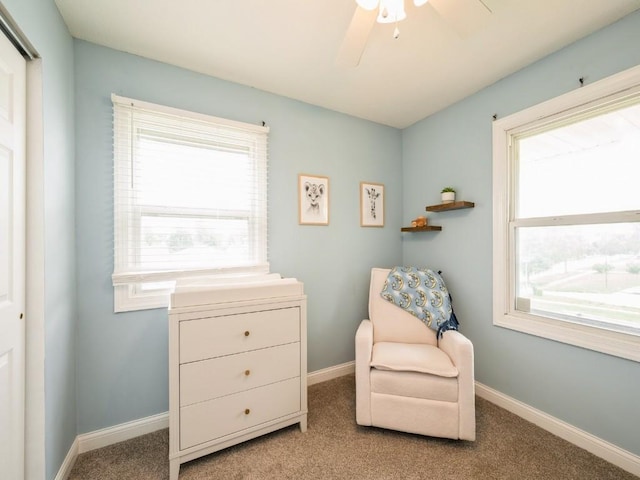 4721 Pine View Dr NE, Cedar Rapids, IA 52402 - living area featuring carpet floors, a ceiling fan, and baseboards