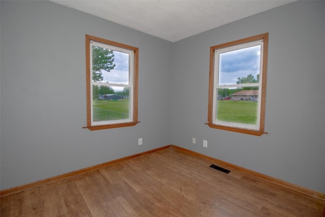 2339 Rompot St SE, Cedar Rapids, IA 52403 - empty room featuring light wood-style flooring and baseboards