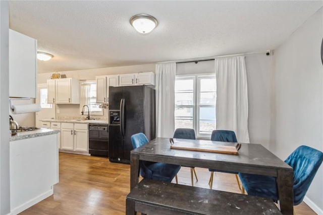 281 NW Jacolyn Dr, Cedar Rapids, IA 52405 - dining space with healthy amount of natural light and light wood-type flooring