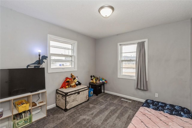281 NW Jacolyn Dr, Cedar Rapids, IA 52405 - carpeted bedroom with baseboards and a textured ceiling