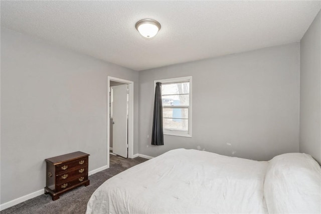 281 NW Jacolyn Dr, Cedar Rapids, IA 52405 - bedroom featuring dark carpet, baseboards, and a textured ceiling