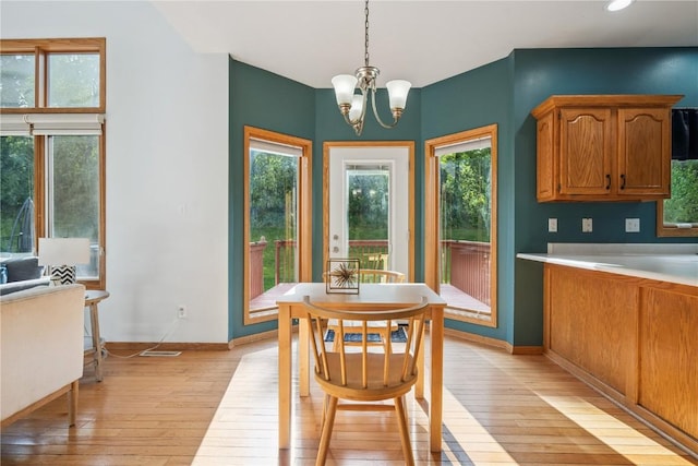 925 Rolling Creek Dr NE, Cedar Rapids, IA 52402 - dining room featuring light wood finished floors, a chandelier, and recessed lighting