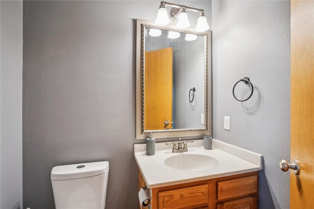 925 Rolling Creek Dr NE, Cedar Rapids, IA 52402 - half bath featuring vanity and a textured wall