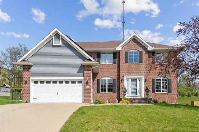 925 Rolling Creek Dr NE, Cedar Rapids, IA 52402 - view of front of house with driveway, brick siding, and an attached garage