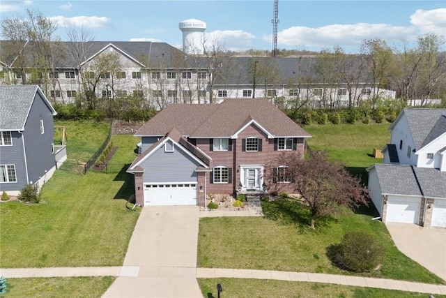925 Rolling Creek Dr NE, Cedar Rapids, IA 52402 - colonial home with driveway, brick siding, a front lawn, and a residential view