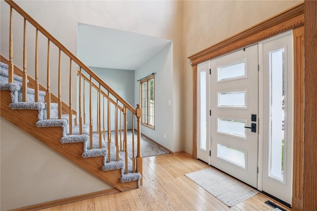 925 Rolling Creek Dr NE, Cedar Rapids, IA 52402 - foyer with stairway, hardwood / wood-style floors, and a towering ceiling
