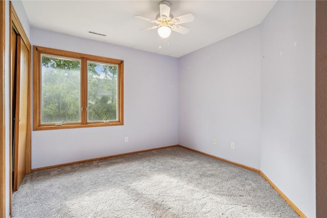 925 Rolling Creek Dr NE, Cedar Rapids, IA 52402 - carpeted spare room featuring baseboards and a ceiling fan