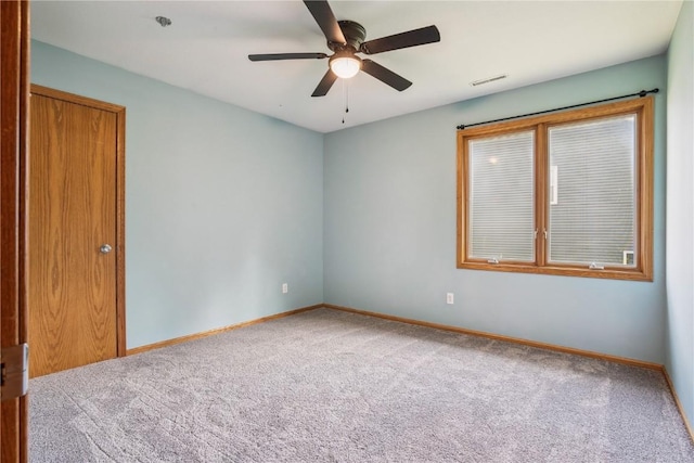 925 Rolling Creek Dr NE, Cedar Rapids, IA 52402 - carpeted empty room with baseboards and a ceiling fan