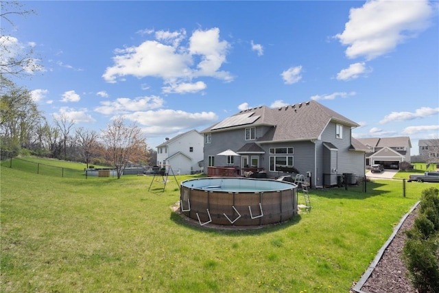 925 Rolling Creek Dr NE, Cedar Rapids, IA 52402 - rear view of house featuring an outdoor pool
