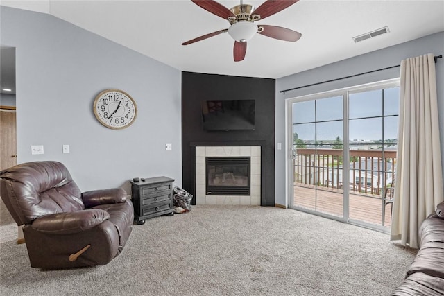 5525 Kacena Ave Unit 7, Marion, IA 52302 - carpeted living room featuring a fireplace and a ceiling fan