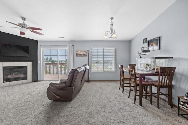 5525 Kacena Ave Unit 7, Marion, IA 52302 - dining space featuring carpet, a fireplace, and plenty of natural light