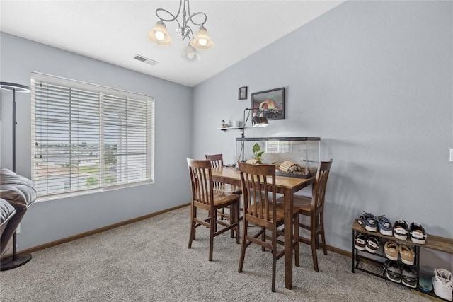 5525 Kacena Ave Unit 7, Marion, IA 52302 - carpeted dining room with a chandelier, baseboards, and lofted ceiling