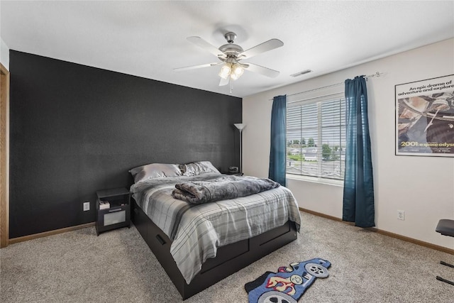 5525 Kacena Ave Unit 7, Marion, IA 52302 - carpeted bedroom with baseboards and a ceiling fan