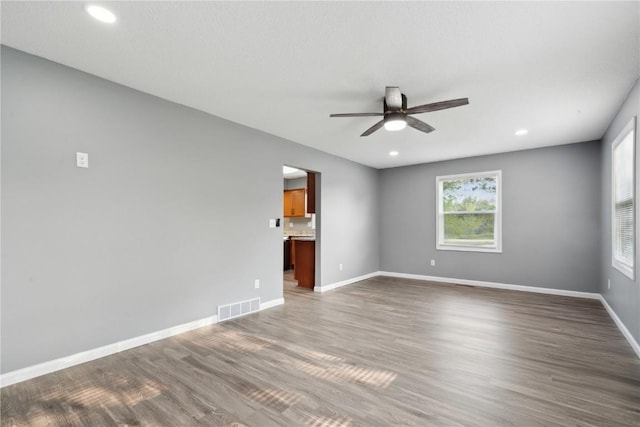 1626 High View Dr, Mount Vernon, IA 52314 - unfurnished room featuring a ceiling fan, wood finished floors, baseboards, and recessed lighting