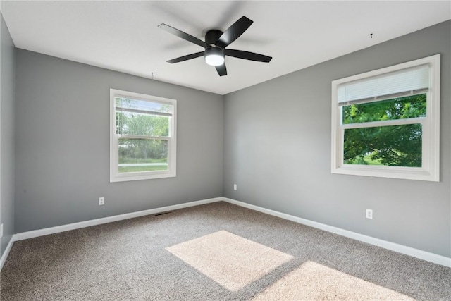 1626 High View Dr, Mount Vernon, IA 52314 - carpeted empty room with a ceiling fan and baseboards