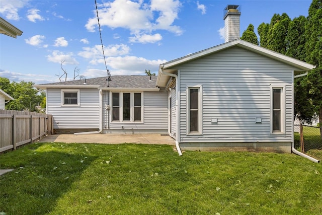 2043 Brookland Dr NE, Cedar Rapids, IA 52402 - rear view of house featuring a patio area and a chimney