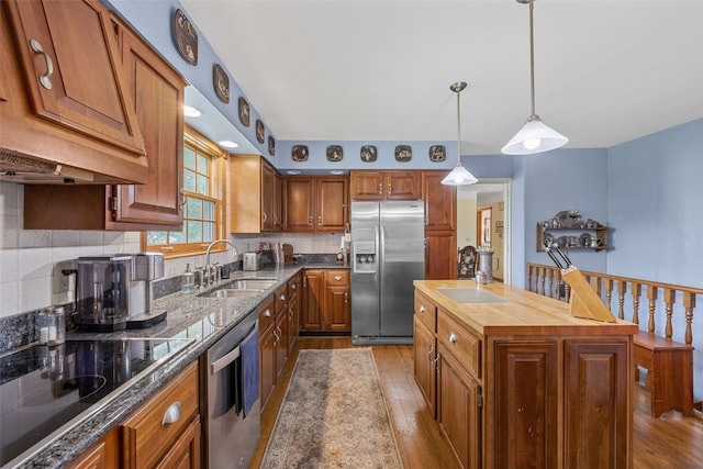 3009 Terry Dr SE, Cedar Rapids, IA 52403 - kitchen featuring stainless steel appliances, a sink, wood finished floors, and wooden counters